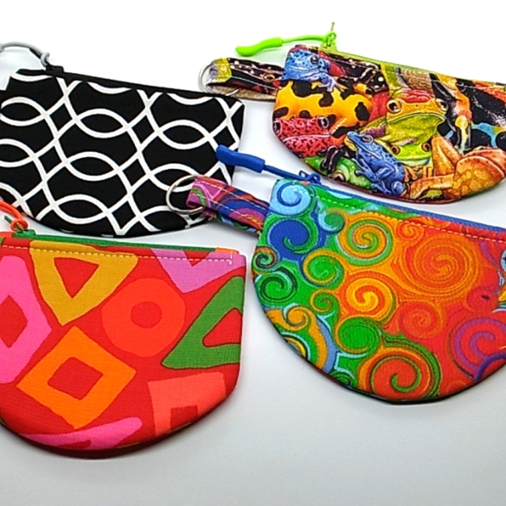 Interfaced, lined, reinforced seams throughout these zippered coin pouches.
